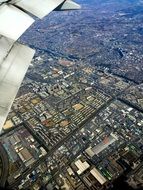 view from the plane to the buildings in the city