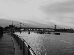 distant view of a bridge in brooklyn in black and white image