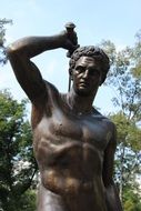 statue of a man in the park close-up