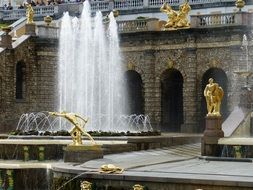 Golden statues near fountains in Petersburg