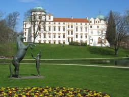 statues on the lawn in front of the castle in germany