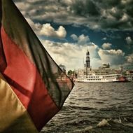 Flag of Germany with Hamburg port in the background