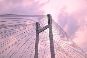 nice suspension bridge at colorful background with the sky in clouds