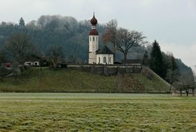 landscape of church on meadow and trees