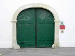 Big green door at the entrance