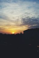 dark silhouettes at sunrise on the horizon