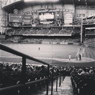 Black and white photo of baseball statue