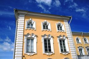 white apricot decorative building facade