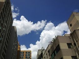 white clouds over buildings