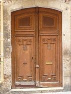 wooden door as a decoration of the facade of a house in spain