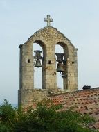 old bell tower on a brick wall