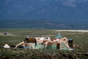 earthen home between mountains