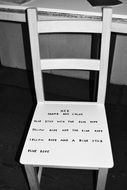 writing on chair, black and white