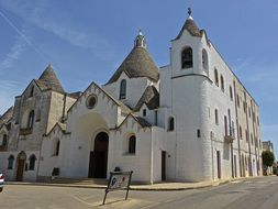 white conical roofed building in Alberobello UNESCO protected in Italy