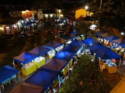 people resting in night city, colombia, medellin, paisa