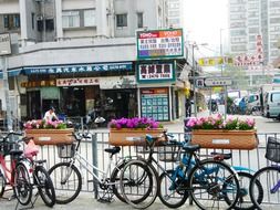 bicycles at street fence, china, hong kong, yuan lang