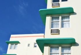 windows of modern hotel facade, usa, florida, miami beach