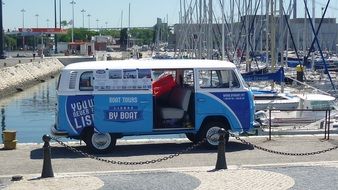 blue bus on the pier