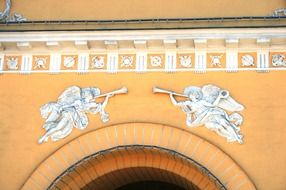 angels with white pipe detail above the entrance