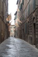 Flags in alley of middle ages in siena