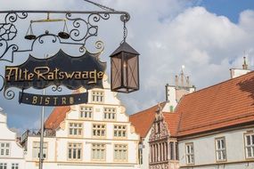 wrought iron signboard on the market of the old town in germany
