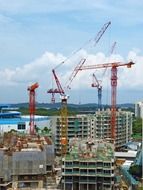 construction cranes on the sky background