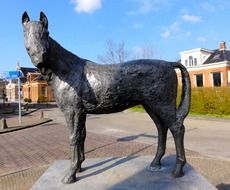statue of a horse among a city in the netherlands