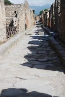 ruins of buildings near the road in italy