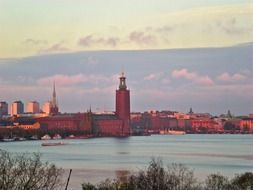 distant view of Stockholm town hall at sunset
