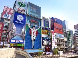 building with neon advertising signs in Osaka