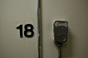 number 18 on the wall of an industrial building