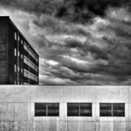 building and clouds urban black and white landscape