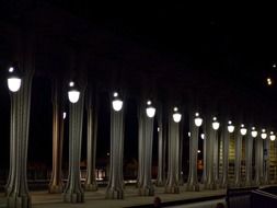 burning street lights on a street of paris