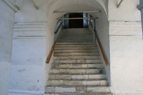 church staircase along the white walls