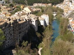 river near multi-story buildings