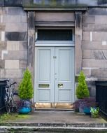 Wooden doors on a stone wall in Edinburgh