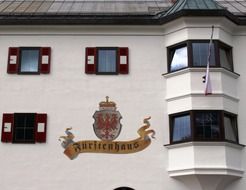 coat of arms on facade with bay windows, austria, pertisau