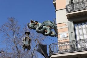 dragon sculpture on a wall in Barcelona