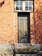 red door brick window