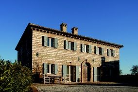 brick house under blue sky