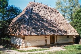 thatched roof on a house in a village in Ukraine