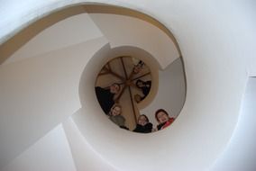 people on the spiral staircase