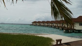 row of bungalows in the sea in the maldives