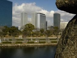 high city buildings near the river