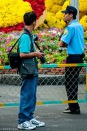 photographer stands near the security guard