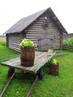 wooden old barn among green meadows