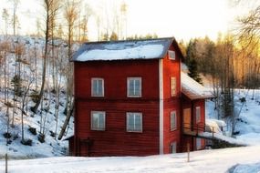 Big house is in the forest in winter