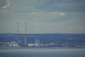 chimneys in a factory near the water