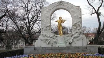 photo of johann strauss statue in the arch