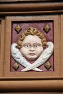 the image of an angel face on a fresco